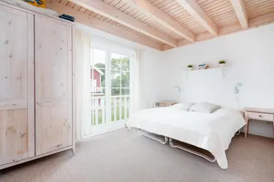Ein Bett oder Betten in einem Zimmer der Unterkunft Strandpark Sierksdorf H075