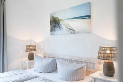 Ein Bett oder Betten in einem Zimmer der Unterkunft Strandpark Sierksdorf H059