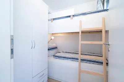 Ein Bett oder Betten in einem Zimmer der Unterkunft Ferienpark Sierksdorf App 52 - Strandlage