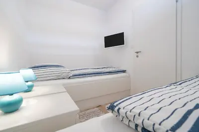 Ein Bett oder Betten in einem Zimmer der Unterkunft Ferienpark Sierksdorf App 52 - Strandlage