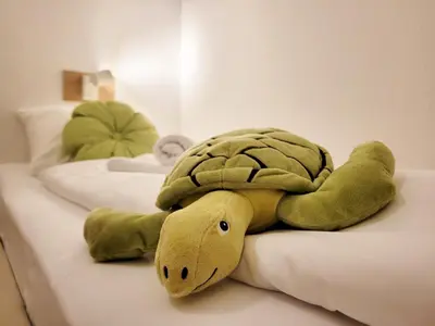 Ein Bett oder Betten in einem Zimmer der Unterkunft Charmante Ferienwohnung mit Terrasse - nur 50m zum Strand mit eigenem Parkplatz und Fahrradunterstellmöglichkeit