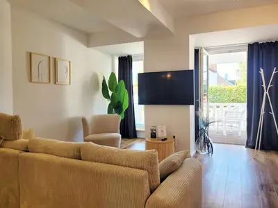 TV/Unterhaltungsangebot in der Unterkunft Ferienwohnung mit Meerblick und Terrasse - Nur 50 Meter zum Strand - inklusive eigenem Parkplatz und Fahrradunterstellplatz