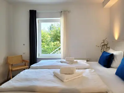 Ein Bett oder Betten in einem Zimmer der Unterkunft Ferienwohnung mit Meerblick und Terrasse - Nur 50 Meter zum Strand - inklusive eigenem Parkplatz und Fahrradunterstellplatz