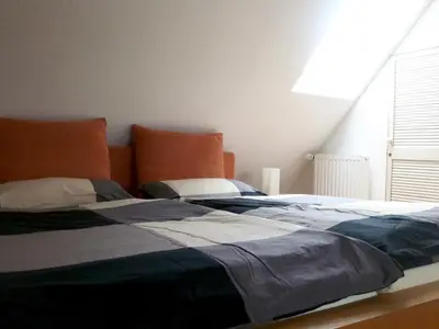 Ein Bett oder Betten in einem Zimmer der Unterkunft Likedeeler Am Stadthafen