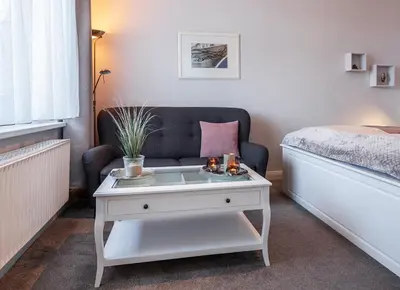 Ein Sitzbereich in der Unterkunft Ferienwohnungen im Kapitänshaus OSTSEEROSE