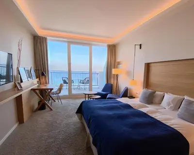 Ein Bett oder Betten in einem Zimmer der Unterkunft SeeHuus Lifestyle Hotel