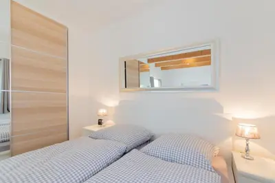 Ein Bett oder Betten in einem Zimmer der Unterkunft Ferienwohnung 3 Haus Meeresrauschen - Bungalow