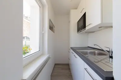Küche/Küchenzeile in der Unterkunft Ferienwohnung 3 Haus Meeresrauschen - Bungalow