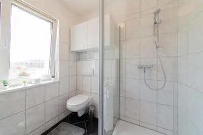 Ein Badezimmer in der Unterkunft Ferienwohnung 3 Haus Meeresrauschen - Bungalow