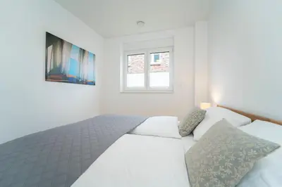 Ein Bett oder Betten in einem Zimmer der Unterkunft Ostseelaune