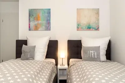 Ein Bett oder Betten in einem Zimmer der Unterkunft MeerGlück Möwenberg 14 Scharbeutz