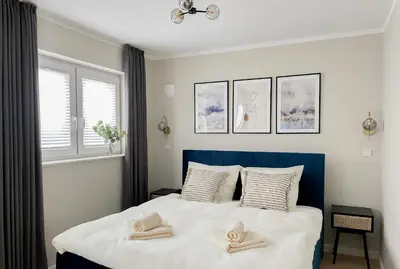 Ein Bett oder Betten in einem Zimmer der Unterkunft My Baltic Sea - Ferienwohnungen im Seaside House