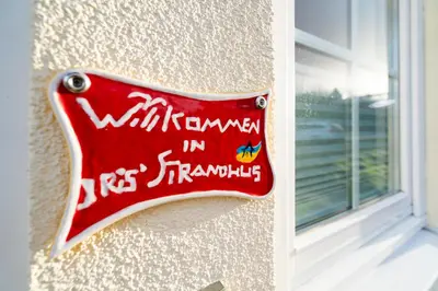 Ein Zertifikat, Auszeichnung, Logo oder anderes Dokument, das in der Unterkunft Iris Strandhus ausgestellt ist