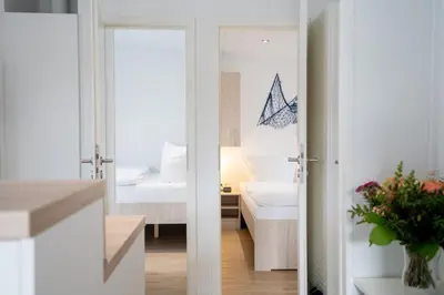 Ein Bett oder Betten in einem Zimmer der Unterkunft Ostseecamp Lübecker Bucht Haus Smutje