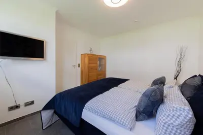 Ein Bett oder Betten in einem Zimmer der Unterkunft Ferienwohnung Sonnendeck 2 Scharbeutz