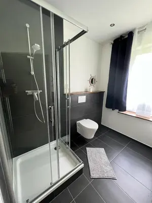 Ein Badezimmer in der Unterkunft Zentrale und schöne Ferienwohnung II