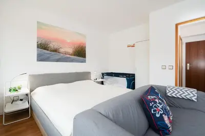Ein Bett oder Betten in einem Zimmer der Unterkunft Ferienpark Sierksdorf App 614 - Strandlage