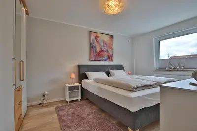 Ein Bett oder Betten in einem Zimmer der Unterkunft Haus am Seehof Ferienwohnung Ostseeliebe