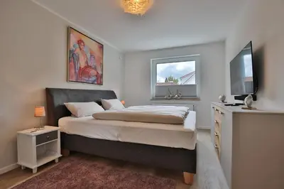 Ein Bett oder Betten in einem Zimmer der Unterkunft Haus am Seehof Ferienwohnung Ostseeliebe