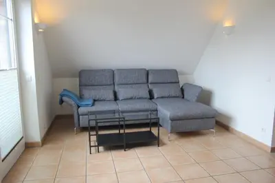 Ein Sitzbereich in der Unterkunft Ferienwohnung Störtebeker