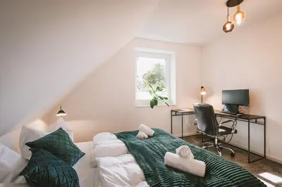 Ein Bett oder Betten in einem Zimmer der Unterkunft Modernes Neubau-Haus Lübeck - Garten, Terrasse, Parkplatz