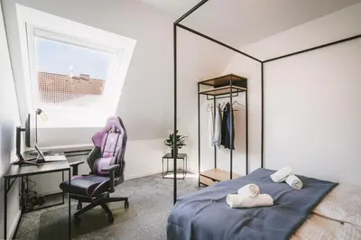 Ein Bett oder Betten in einem Zimmer der Unterkunft Modernes Neubau-Haus Lübeck - Garten, Terrasse, Parkplatz