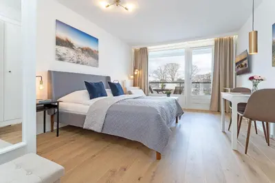 Ein Bett oder Betten in einem Zimmer der Unterkunft Haus Meeresstrand BeachBude Scharbeutz