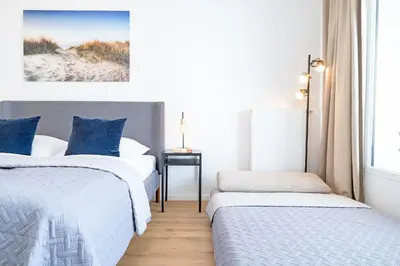Ein Bett oder Betten in einem Zimmer der Unterkunft Haus Meeresstrand BeachBude Scharbeutz