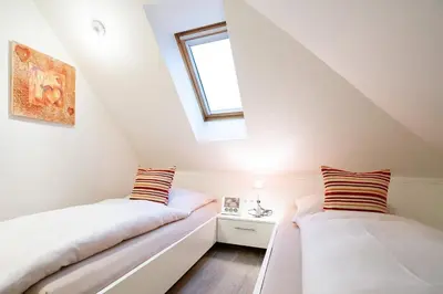 Ein Bett oder Betten in einem Zimmer der Unterkunft Seesand Nr 10