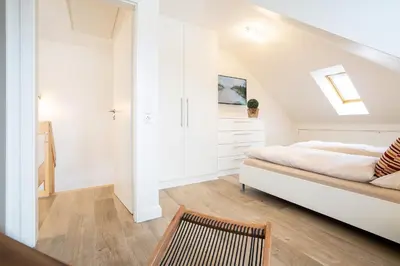 Ein Bett oder Betten in einem Zimmer der Unterkunft Seesand Nr 10