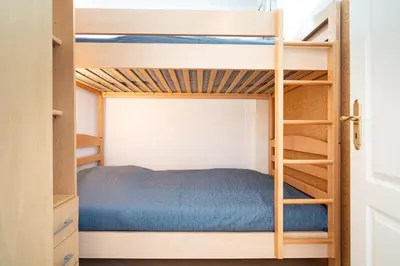 Ein Etagenbett oder Etagenbetten in einem Zimmer der Unterkunft Ferienpark Sierksdorf App 106 - Strandlage