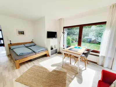 Ein Bett oder Betten in einem Zimmer der Unterkunft Ferienwohnung Gartenblick - Idylle am Travetal