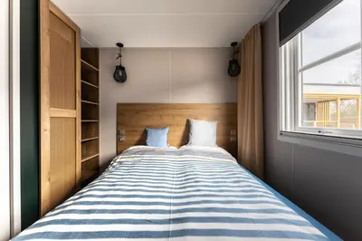 Ein Bett oder Betten in einem Zimmer der Unterkunft Boje 70