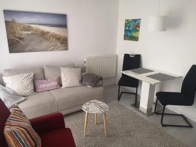 Ein Sitzbereich in der Unterkunft Sunshine Apartment