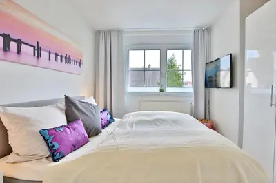 Ein Bett oder Betten in einem Zimmer der Unterkunft Residenz am Kurpark Residenz am Kurpark Appartement 4