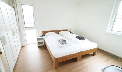 Ein Bett oder Betten in einem Zimmer der Unterkunft Ferienwohnung Trave - Wohlfühlatmosphäre zum Auftanken