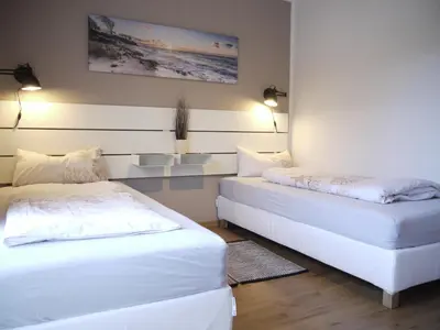 Ein Bett oder Betten in einem Zimmer der Unterkunft Ferienhaus Oceansounds