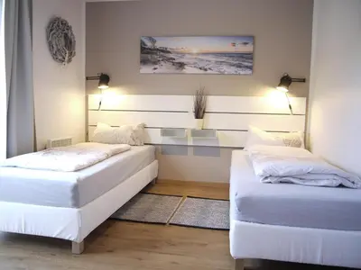 Ein Bett oder Betten in einem Zimmer der Unterkunft Ferienhaus Oceansounds