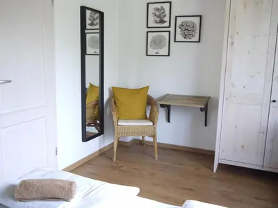 Ein Bett oder Betten in einem Zimmer der Unterkunft Ferienhaus Oceansounds