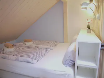 Ein Bett oder Betten in einem Zimmer der Unterkunft Ferienhaus Oceansounds