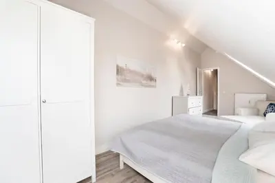 Ein Bett oder Betten in einem Zimmer der Unterkunft Kammerweg 89 Düne 28