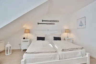 Ein Bett oder Betten in einem Zimmer der Unterkunft Haus Seesand Penthouse Wohlfühlzeit