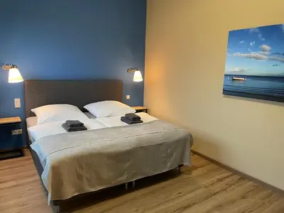Ein Bett oder Betten in einem Zimmer der Unterkunft Ferienwohnung 3 am Herrenhaus Ahrensbök