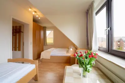 Ein Bett oder Betten in einem Zimmer der Unterkunft AMW1 Ferienwohnung Garbers Thiele