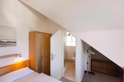 Ein Bett oder Betten in einem Zimmer der Unterkunft ARW3b Ferienwohnung Walden F