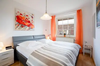 Ein Bett oder Betten in einem Zimmer der Unterkunft DKK7b Ferienwohnung Strandmuschel F