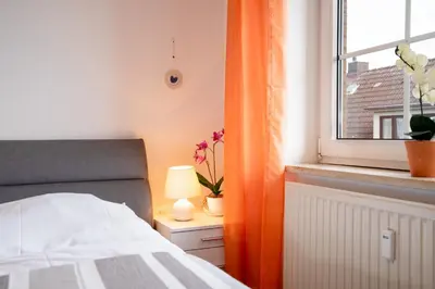 Ein Bett oder Betten in einem Zimmer der Unterkunft DKK7b Ferienwohnung Strandmuschel F