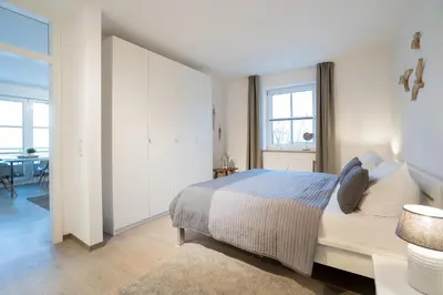 Ein Bett oder Betten in einem Zimmer der Unterkunft GAR4b Appartementhaus 