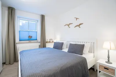 Ein Bett oder Betten in einem Zimmer der Unterkunft GAR4c Appartementhaus 