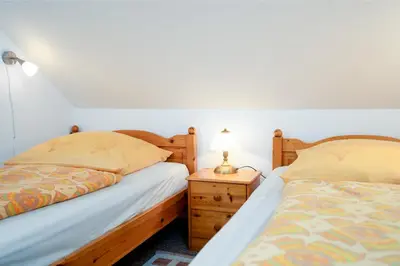 Ein Bett oder Betten in einem Zimmer der Unterkunft HER14a Ferienwohnung Hartig